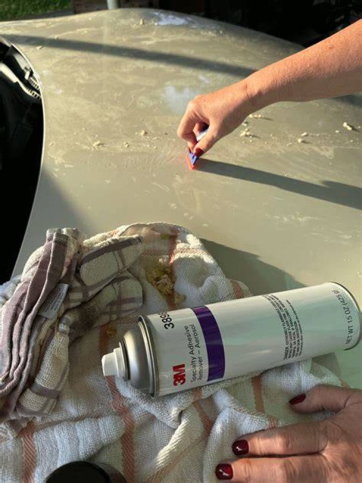 How do I remove adhesive from car upholstery