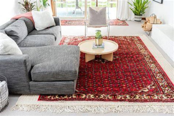 Should I put rug on carpet