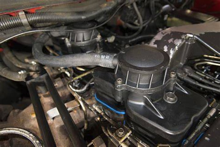 What does the valve cover breather do